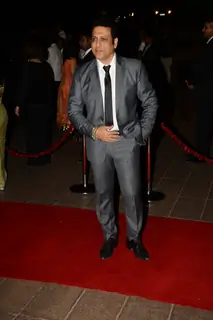 Govinda poses for the media at Arpita Khan's Wedding Reception