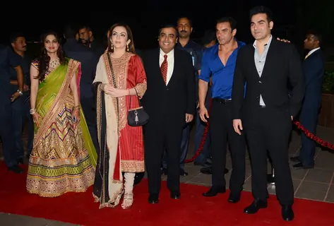 Mukesh and Nita Ambani pose with Arbaaz and Sohail Khan at Arpita Khan's Wedding Reception
