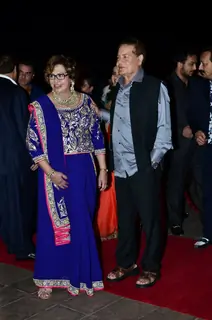 Salim Khan and Helen pose for the media at Arpita Khan's Wedding Reception