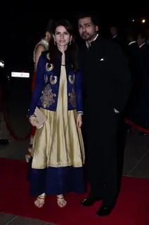 Nikhil Dwivedi with wife Gauri pose for the media at Arpita Khan's Wedding Reception