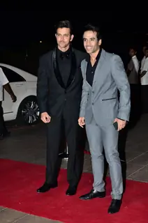 Hrithik Roshan and Tusshar Kapoor pose for the media at Arpita Khan's Wedding Reception