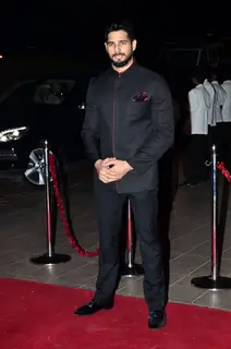 Sidharth Malhotra poses for the media at Arpita Khan's Wedding Reception