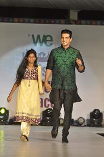 Zayed Khan walks the ramp with a small girl at Wellingkar's 26/11 Tribute