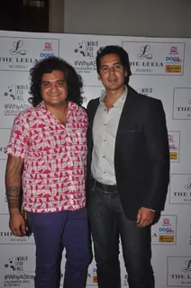 Dino Morea poses with Sahil Mane at 'Why A Stray' Calendar Launch