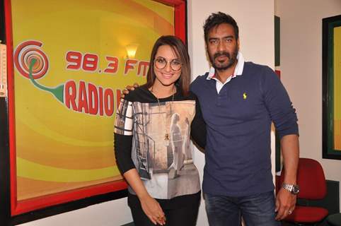 Ajay Devgn and Sonakshi Sinha pose for the media at the Promotions of Action Jackson at Radio Mirchi