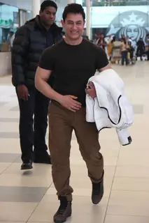 Aamir Khan poses for the media at Airport while returning from Delhi
