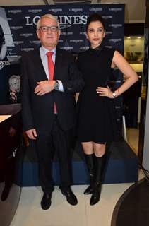 Aishwarya Rai Bachchan poses with an official at the Launch of Longines Store