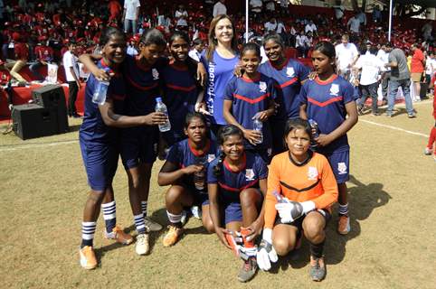 Nita Ambani poses with the players at the Launch of '#grassroots football movement'