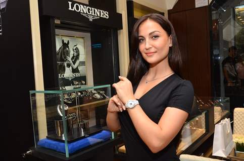 Elli Avram showcases a watch at the Watches of the World Showroom