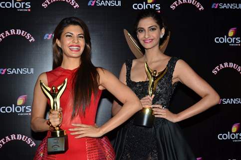 Jacqueline Fernandes and Sonam Kapoor pose with their Awards at Sansui Stardust Awards Red Carpet