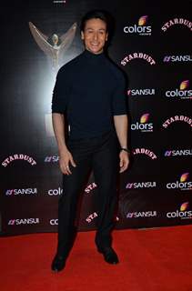 Tiger Shroff poses for the media at Sansui Stardust Awards Red Carpet