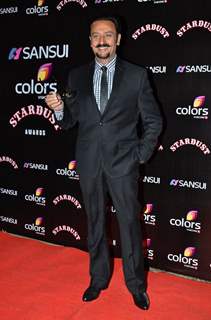 Gulshan Grover poses for the media at Sansui Stardust Awards Red Carpet