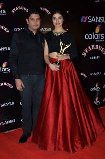 Bhushan Kumar poses with wife Divya Kumar at the Sansui Stardust Awards Red Carpet