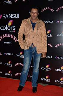 Madhur Bhandarkar poses for the media at Sansui Stardust Awards Red Carpet