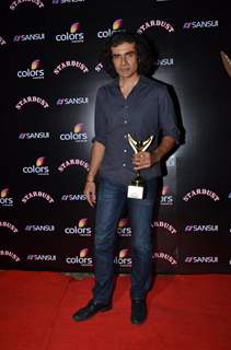 Imtiaz Ali poses for the media at Sansui Stardust Awards Red Carpet