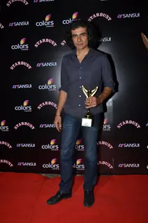 Imtiaz Ali poses for the media at Sansui Stardust Awards Red Carpet
