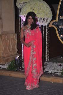 Priyanka Chopra poses for the media at the Wedding Reception of Riddhi Malhotra and Tejas Talwalkar