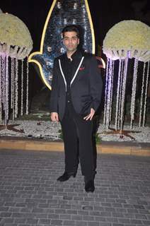 Karan Johar poses for the media at the Wedding Reception of Riddhi Malhotra and Tejas Talwalkar