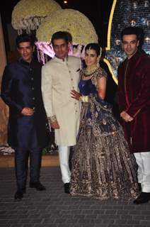 Manish and Punit Malhotra pose with the newly wedded couple Riddhi Malhotra and Tejas Talwalkar