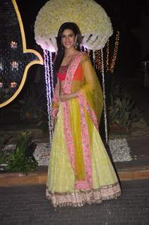 Kriti Sanon poses for the media at the Wedding Reception of Riddhi Malhotra and Tejas Talwalkar