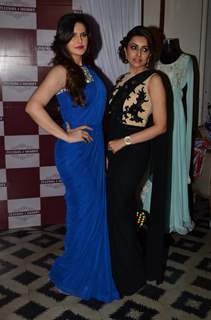 Zarine Khan poses with a friend at Zluekha Shariff Collection Launch