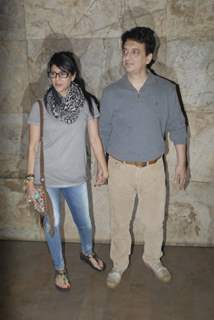 Sajid Nadiadwala poses with wife at the Special Screening of P.K.