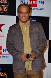 Vipin Sharma poses for the media at Big Star Entertainment Awards 2014