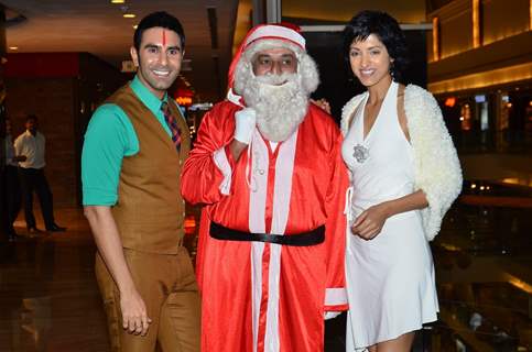 Sandip Soparkar and Jessy Randhawa pose with Santa Claus at their Christmas Bash