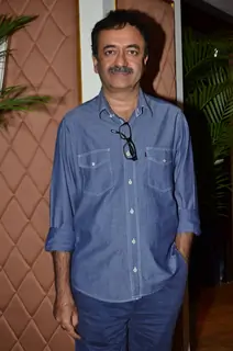 Rajkumar Hirani poses for the media at P.K. Contest Winners Meet