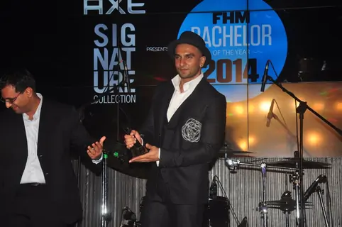 Ranveer Singh poses with his award at FHM Bachelor of the Year Bash