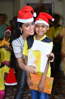 Shriya Saran poses for the media at the Christmas Celebration with Access Life NGO Kids