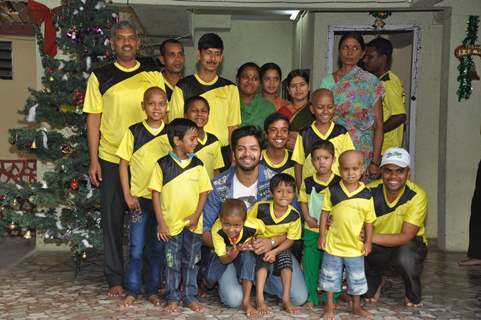 Ali Fazal poses with Ngo Kids at the Christmas Celebrations