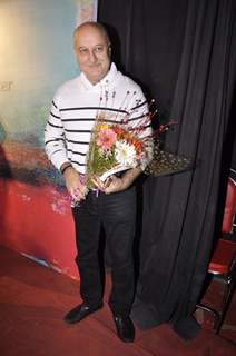 Anupam Kher poses for the media at Ali Peter John Book Launch