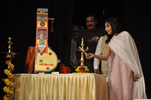 Feryna Wazheir lights the lamp at Ali Peter John Book Launch