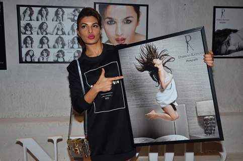 Jacqueline Fernandes poses with her photo at Dabboo Ratnani's Calendar Launch