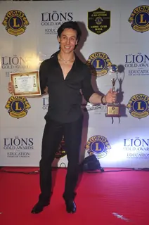 Tiger Shroff poses for the media at Lion Gold Awards
