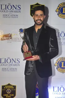 Abhishek Bachchan poses with her award at Lion Gold Awards