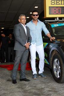 John Abraham poses with an official at SCMM Marathon Meet