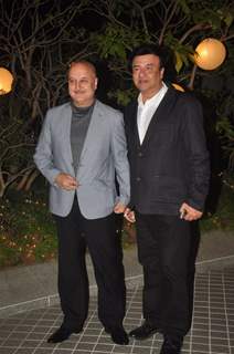 Anupam Kher and Anu Malik pose for the media at Farah Khan's Birthday Bash
