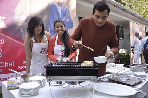 Sanjeev Kapoor prepares a dish at the Launch of Master Chef Season 4