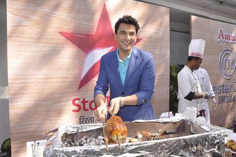 Vikas Khanna prepares a dish at the Launch of Master Chef Season 4