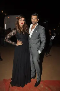 Bipasha Basu and Karan Singh Grover pose for the media at Umang Police Show