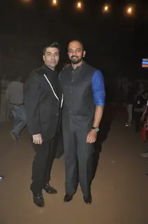 Karan Johar and Rohit Shetty pose for the media at Umang Police Show