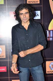 Imtiaz Ali poses for the media at Star Guild Awards