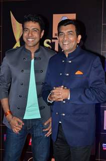 Ranveer Brar and Sanjeev Kapoor pose for the media at Star Guild Awards