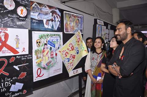 Ajay Devgn checks through the posters at National Youth Day Event