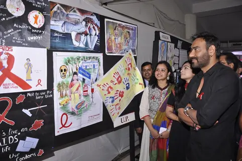 Ajay Devgn checks through the posters at National Youth Day Event