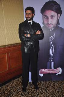 Abhishek Bachchan poses for the media at the Press Conference of the 60th Filmfare Awards 2014