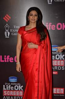 Tabu poses for the media at 21st Annual Life OK Screen Awards Red Carpet