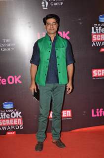 Sushant Singh poses for the media at 21st Annual Life OK Screen Awards Red Carpet